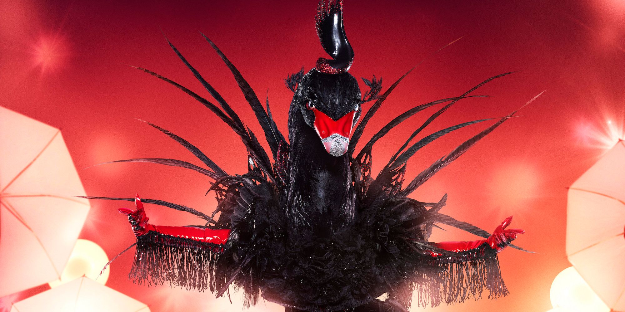 The Black Swan, JoJo, poses on stage in The Masked Singer