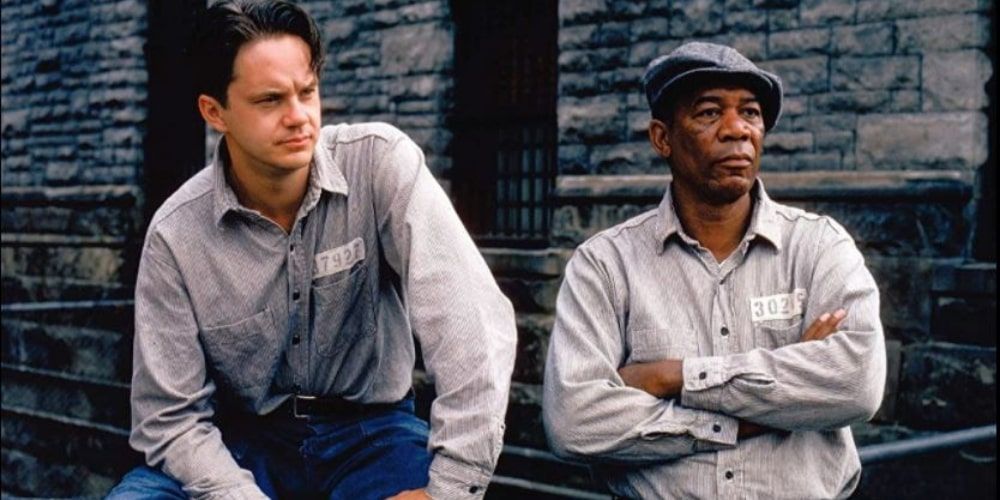 Prison yard scene in Shawshank Redemption with Red and Andy leaning against wall