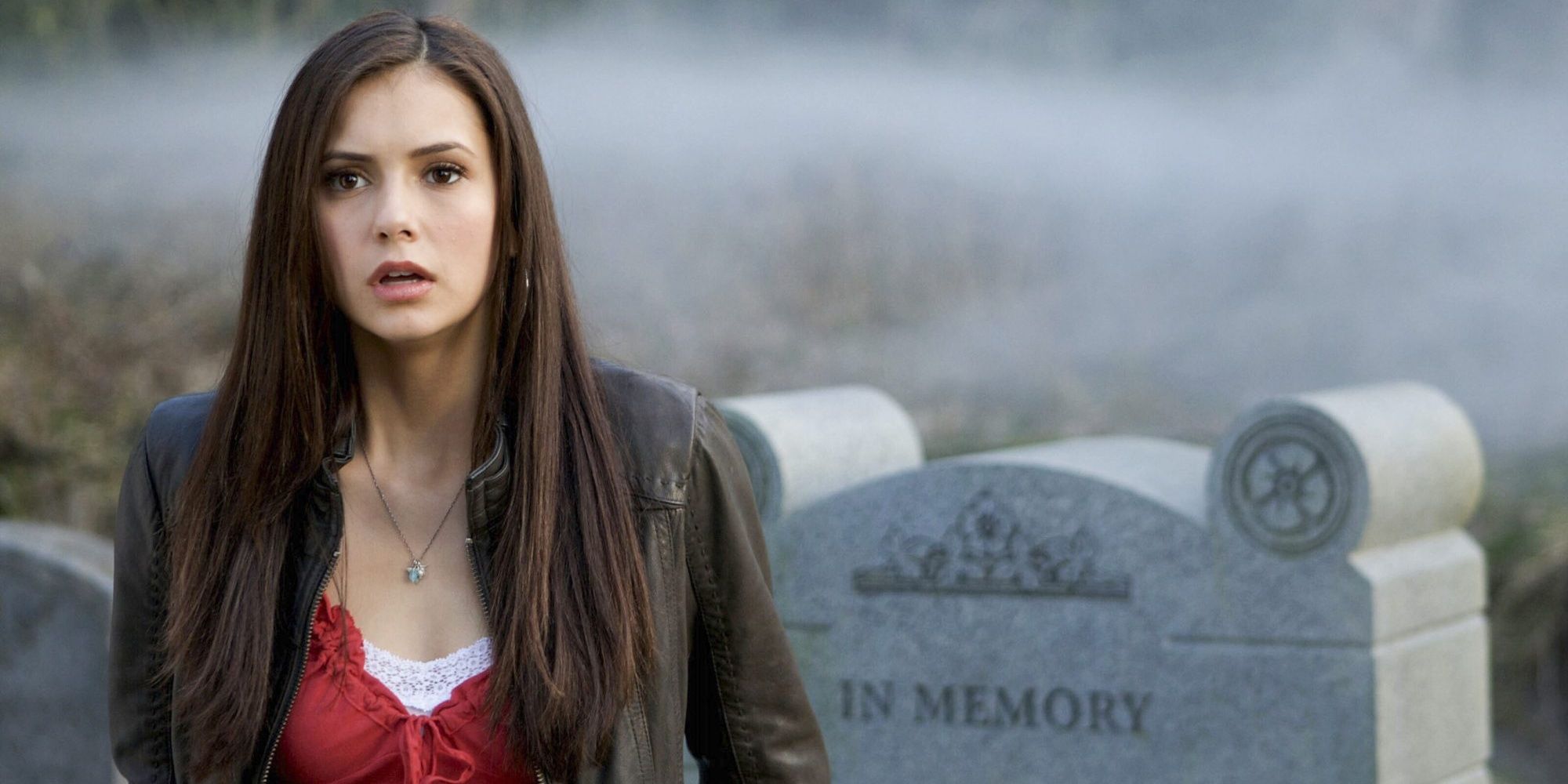 Elena in the graveyard looking shocked in The Vampire Diaries