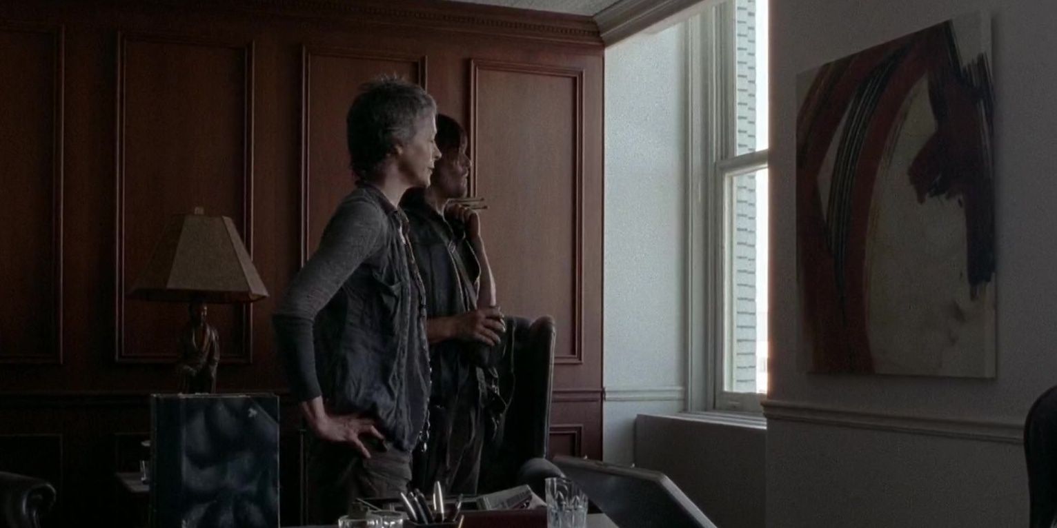 Daryl and Carol look at a painting in Season 5 Episode 6 of The Walking Dead