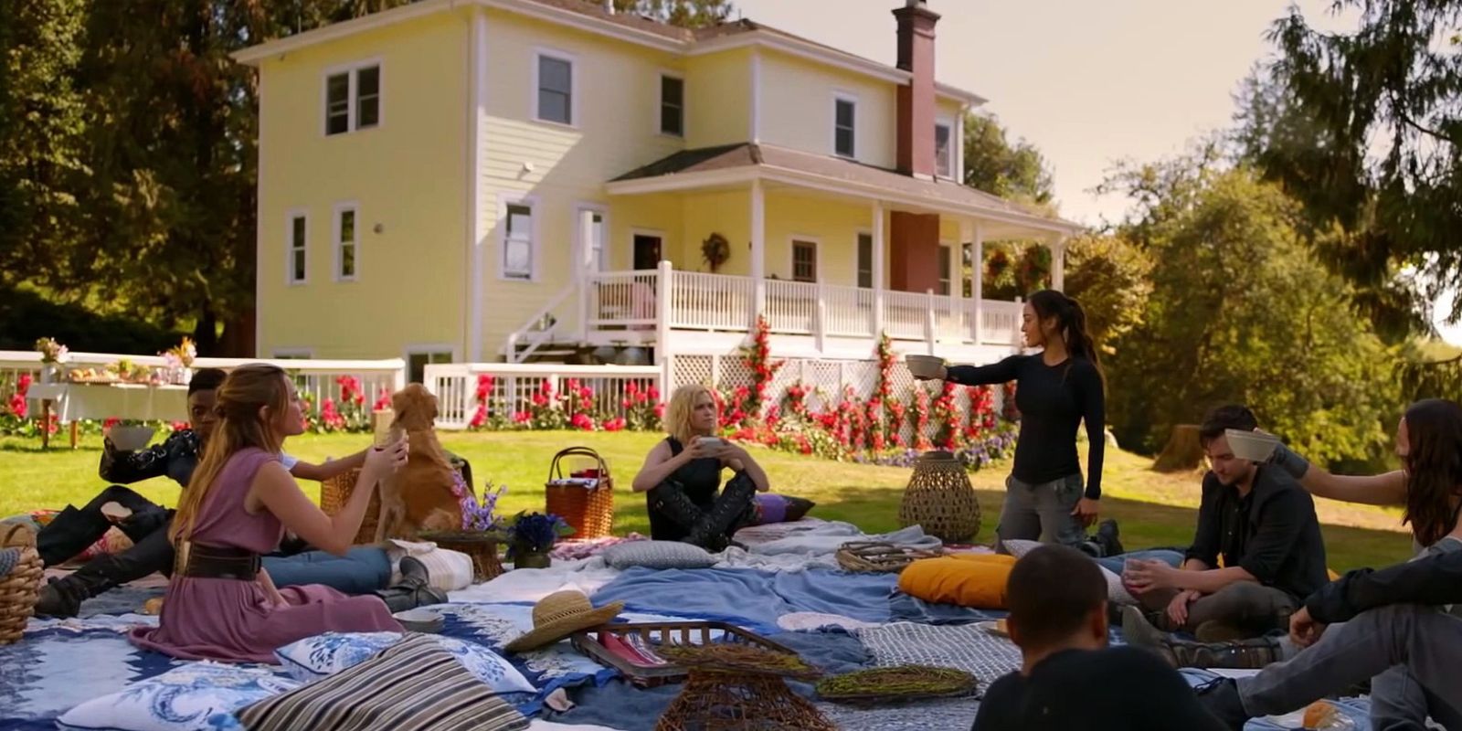 The main characters enjoy a picnic at the start of The 100 season 7