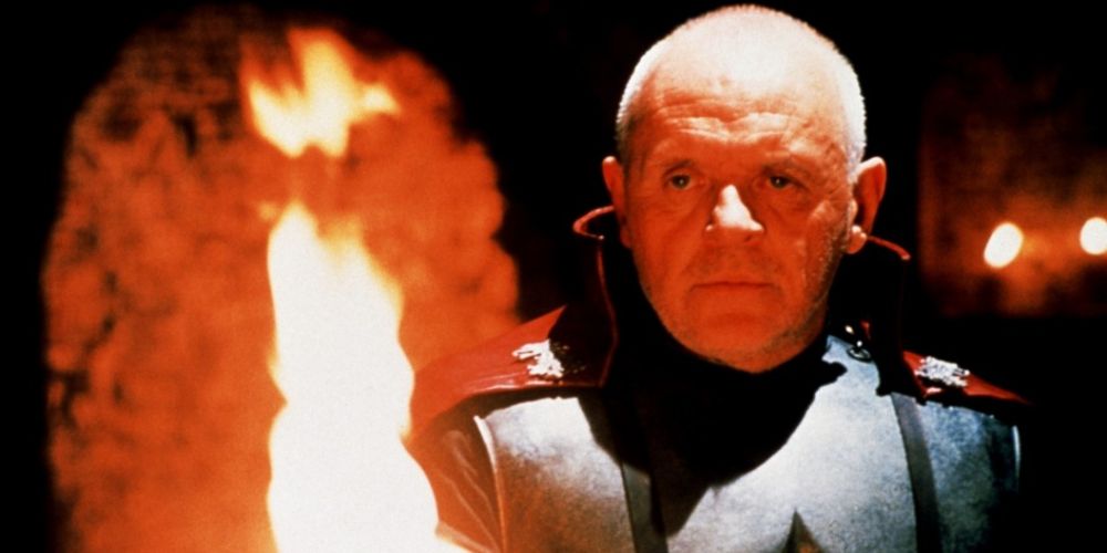 Anthony Hopkins starring into a fire in Titus.