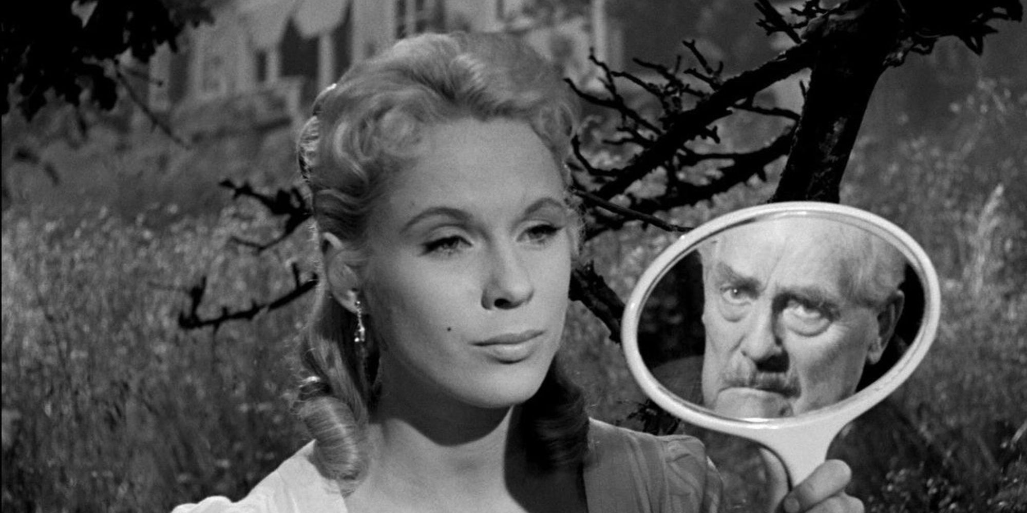 Scene from Wild Strawberries with woman holding mirror.