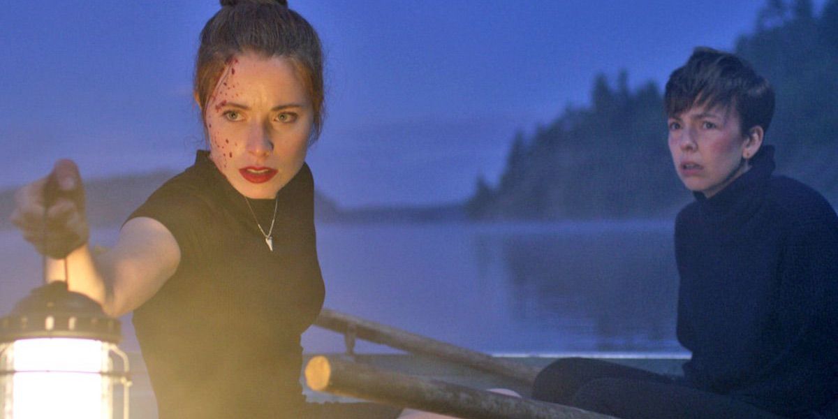 The main characters in What Keeps You Alive on a boat at night in the middle of a lake