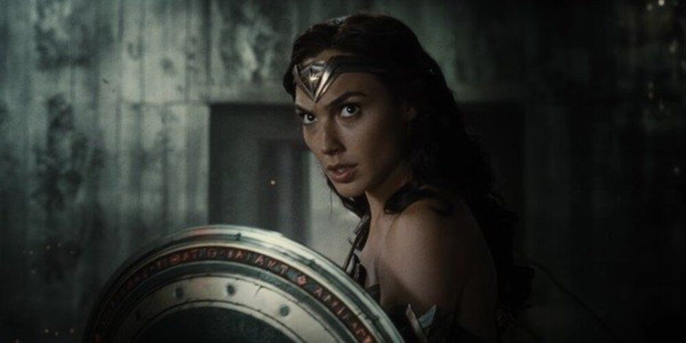 Wonder Woman with an angry expression holding shield