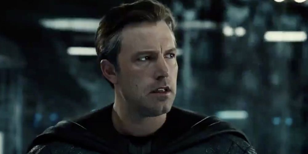 Ben Affleck as Batman talking to the Justice League with a serious expression