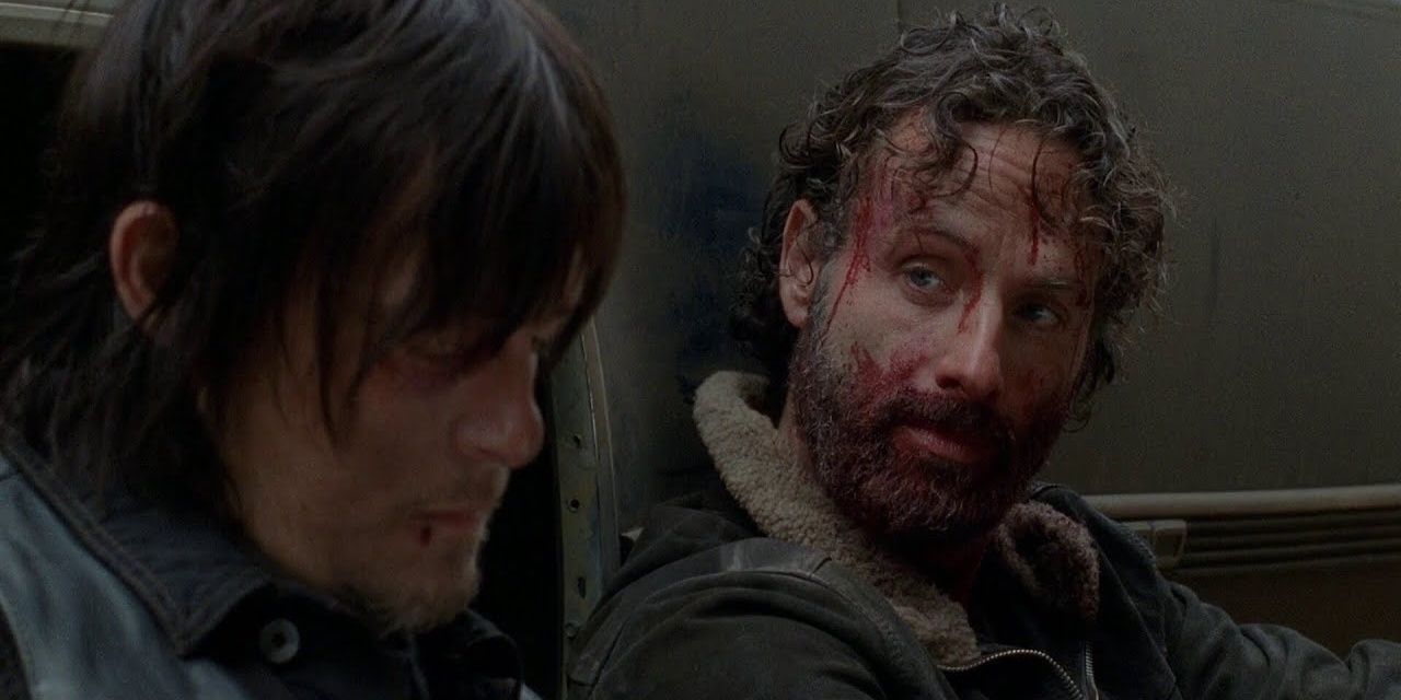 A bloodied rick looks at daryl 