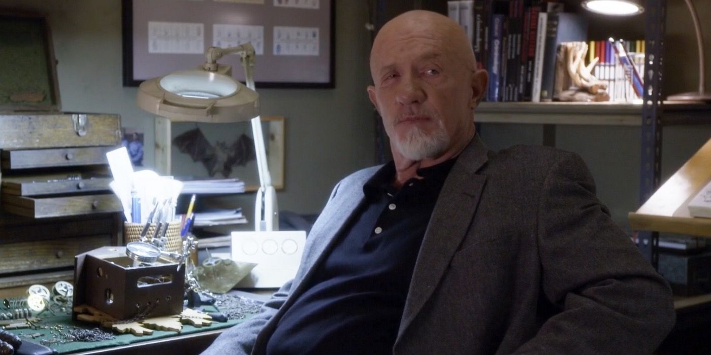 Buzz Hickey sitting at his desk in Community.