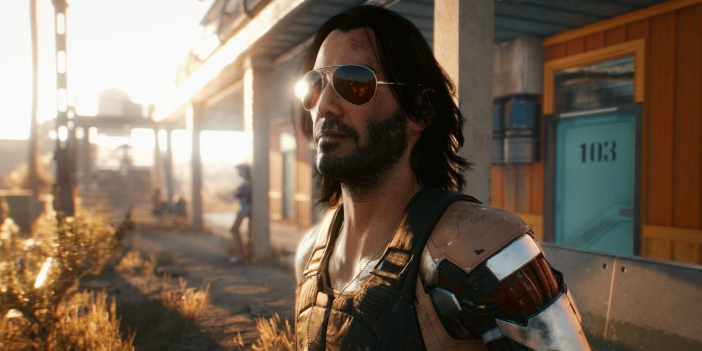 Johnny Silverhand stands outside a hotel in Cyberpunk 2077