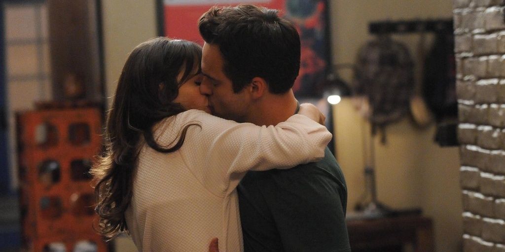 Jess and Nick sharing their first kiss in New Girl
