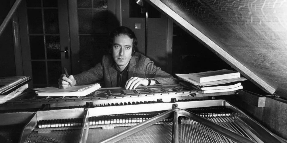 John Barry composes on piano