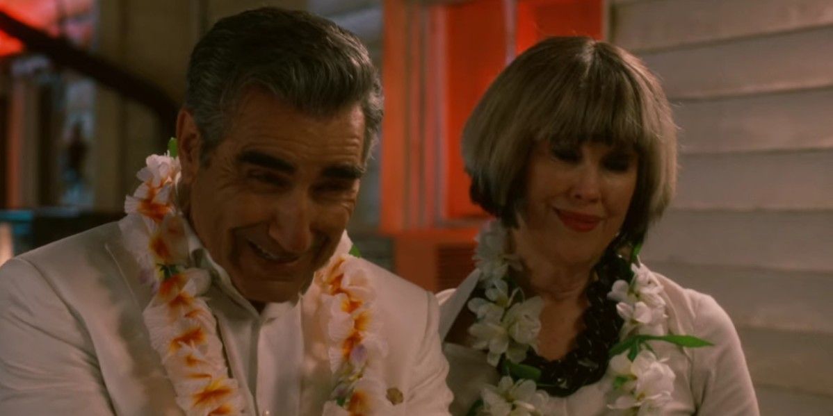 Johnny and Moira at luau wearing leis
