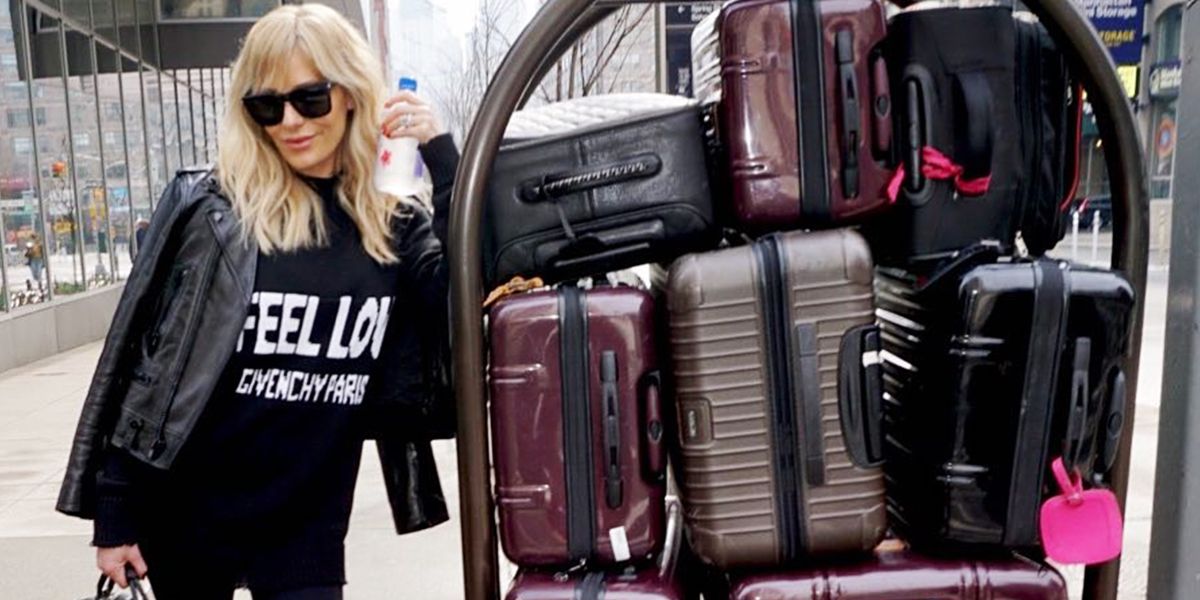Dorit traveling with suitcases 