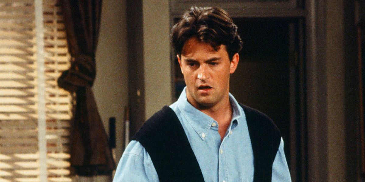 Matthew Perry looking down and talking on Friends