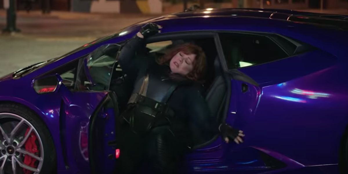 Lydia (Melissa McCarthy) getting out of sportscar in Thunder Force trailer.