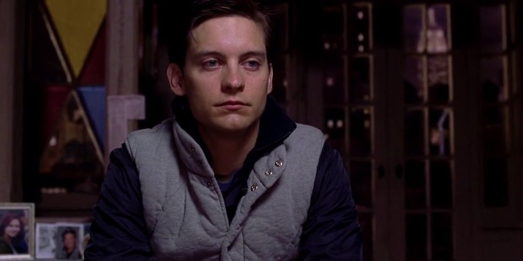 peter parker sits in his apartment sadly in spider-man 2