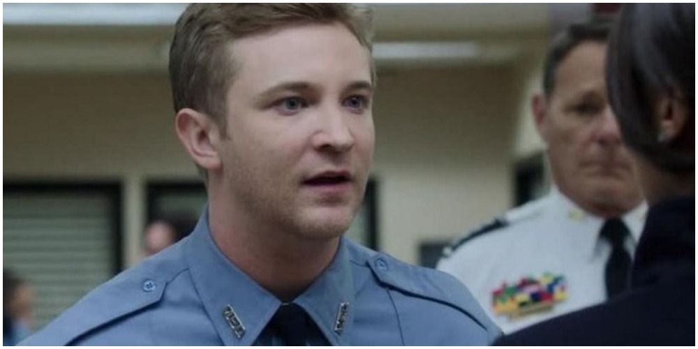 Michael Welch from Scandal with blue shirt on talking