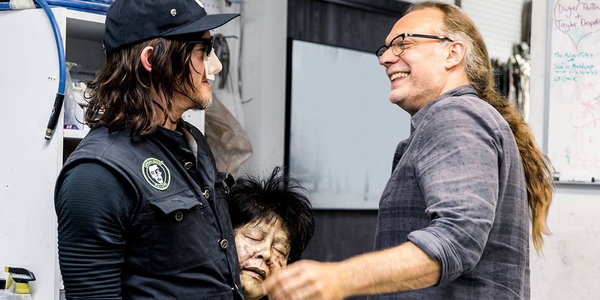 Greg Nicotero shakes Norman Reedus' hand