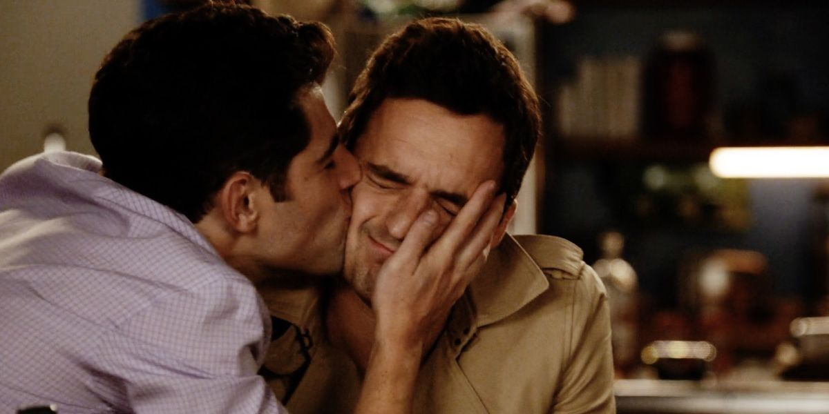 Schmidt giving Nick a kiss