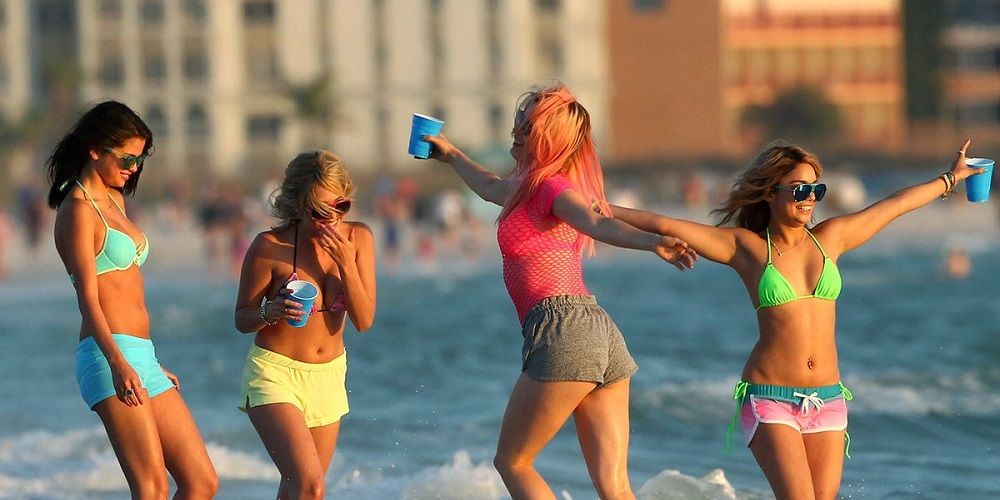 Candy, Faith, Brit, and Cotty frolic in ocean in Spring Breakers