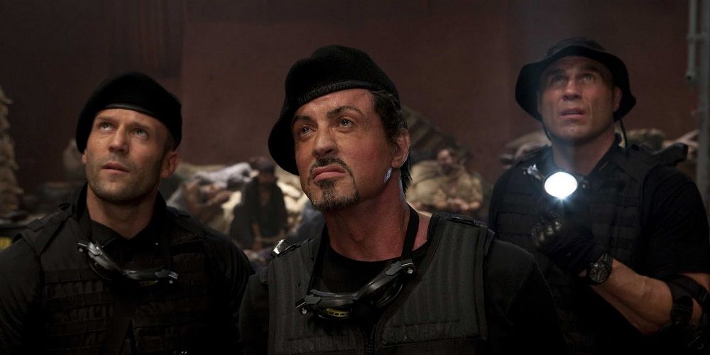 Barney, Lee and Toll searching in The Expendables