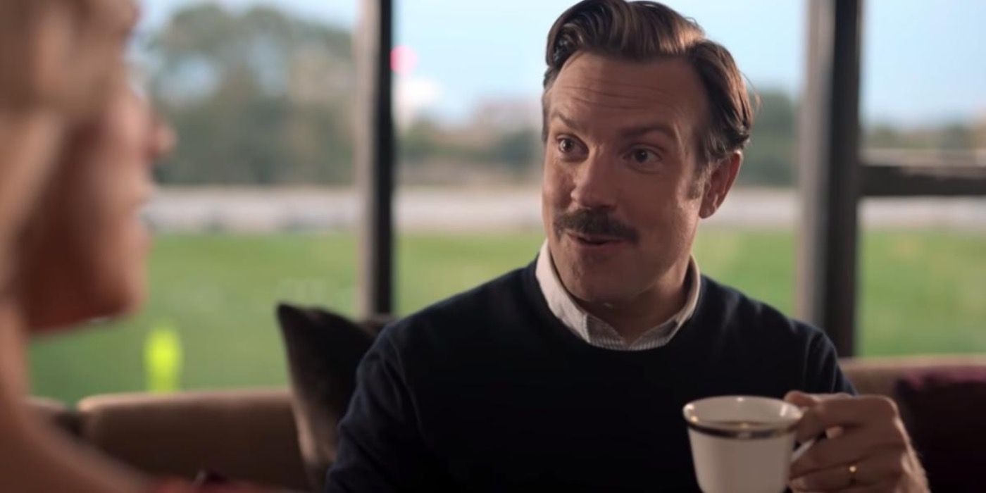 Jason Sudeikis as Ted Lasso, drinking tea.