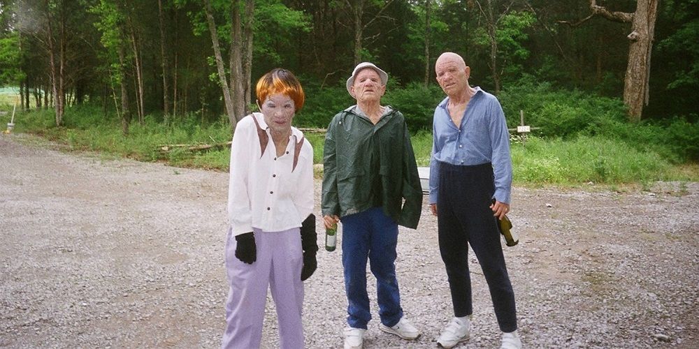 Three masked peeping toms in Trash Humpers