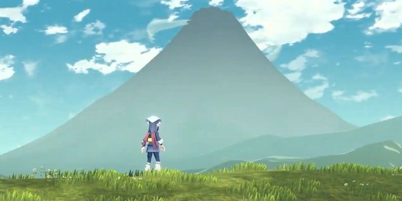 Akari standing in front of Mt Coronet in Legends Arceus