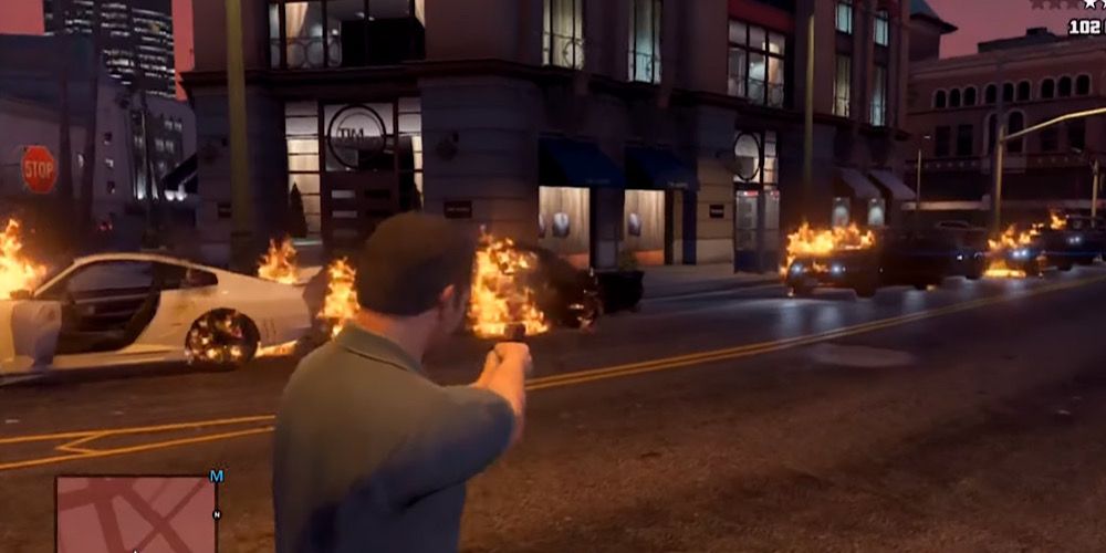 Michael sets cars on fire using the Flaming Bullet cheat