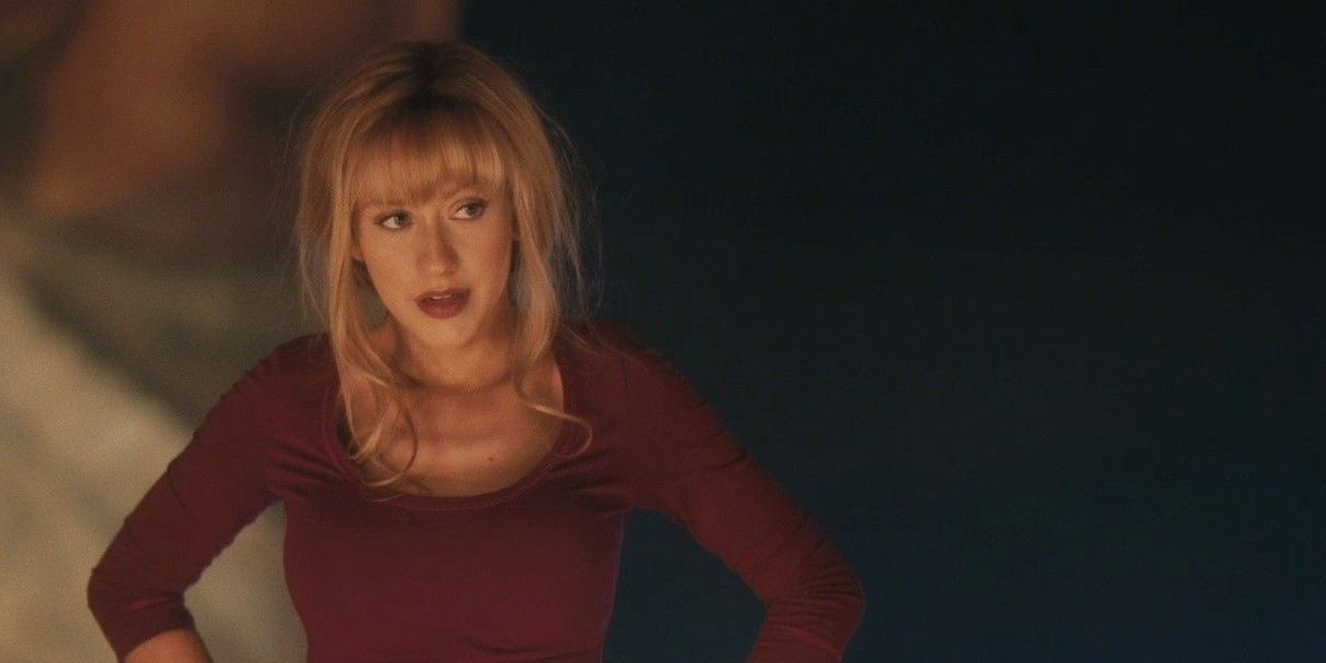 Ali in a red top in Burlesque