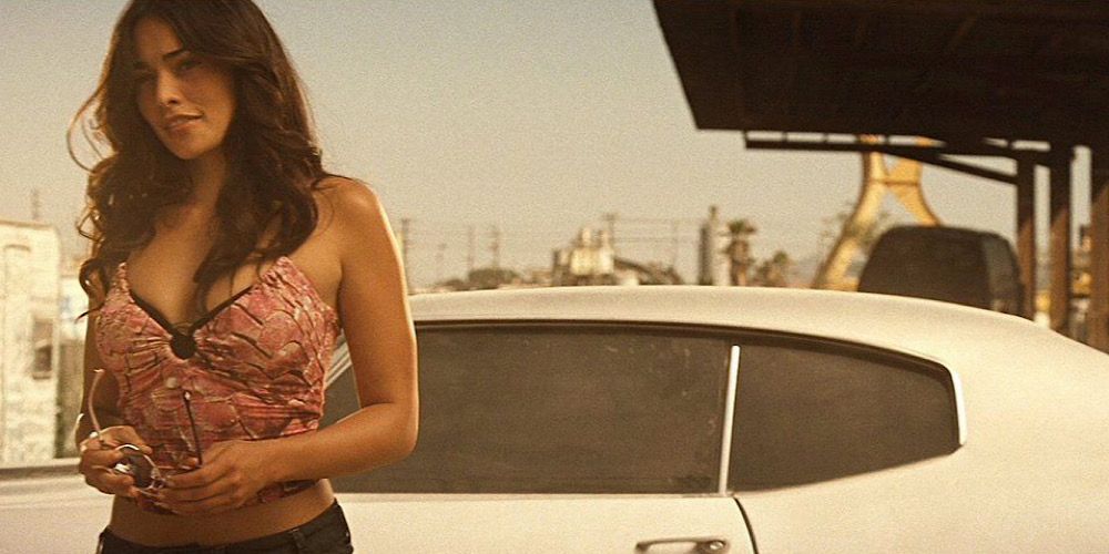 Natalie Martinez exits a muscle car in Death Race