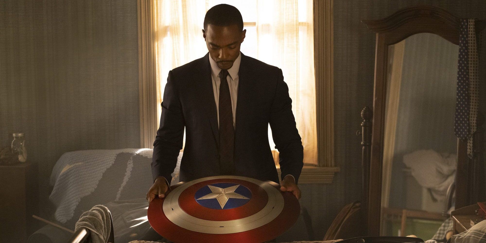 Sam Wilson holds the shield in The Falcon and the Winter Soldier.