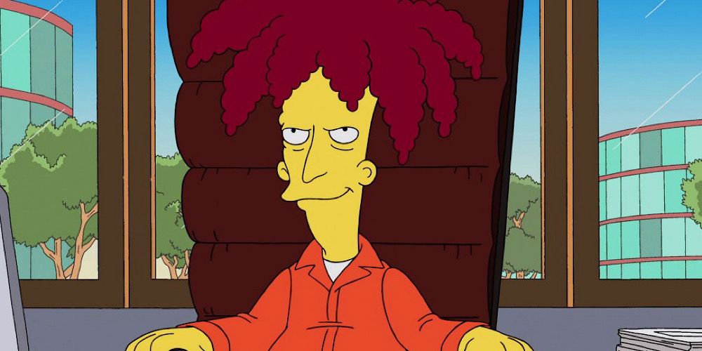 Sideshow Bob in a chair, smiling in The Simpsons