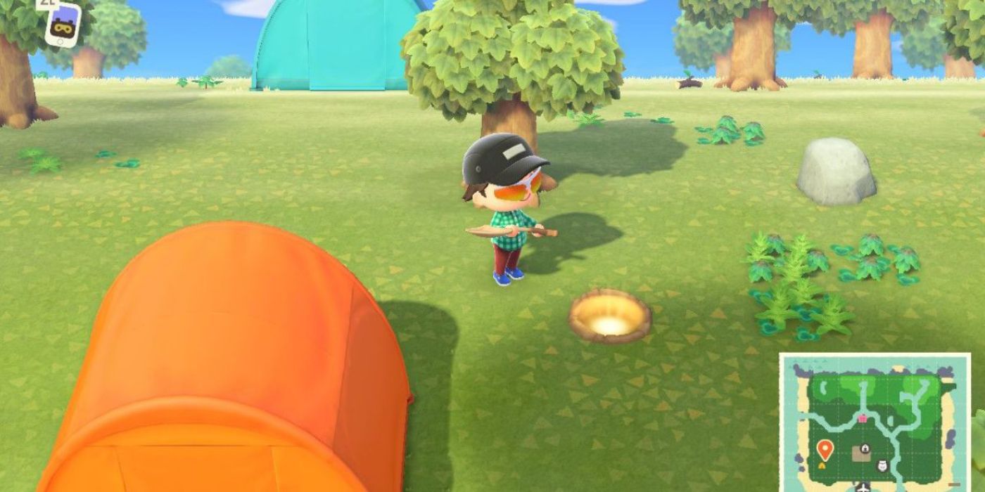 Ein Spieler gräbt in Animal Crossing New Horizons ein Loch voller Glocken