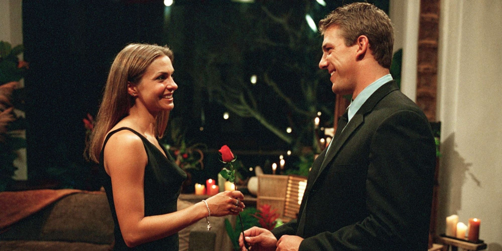 Aaron Buerge handing a rose to Helene in The Bachelor