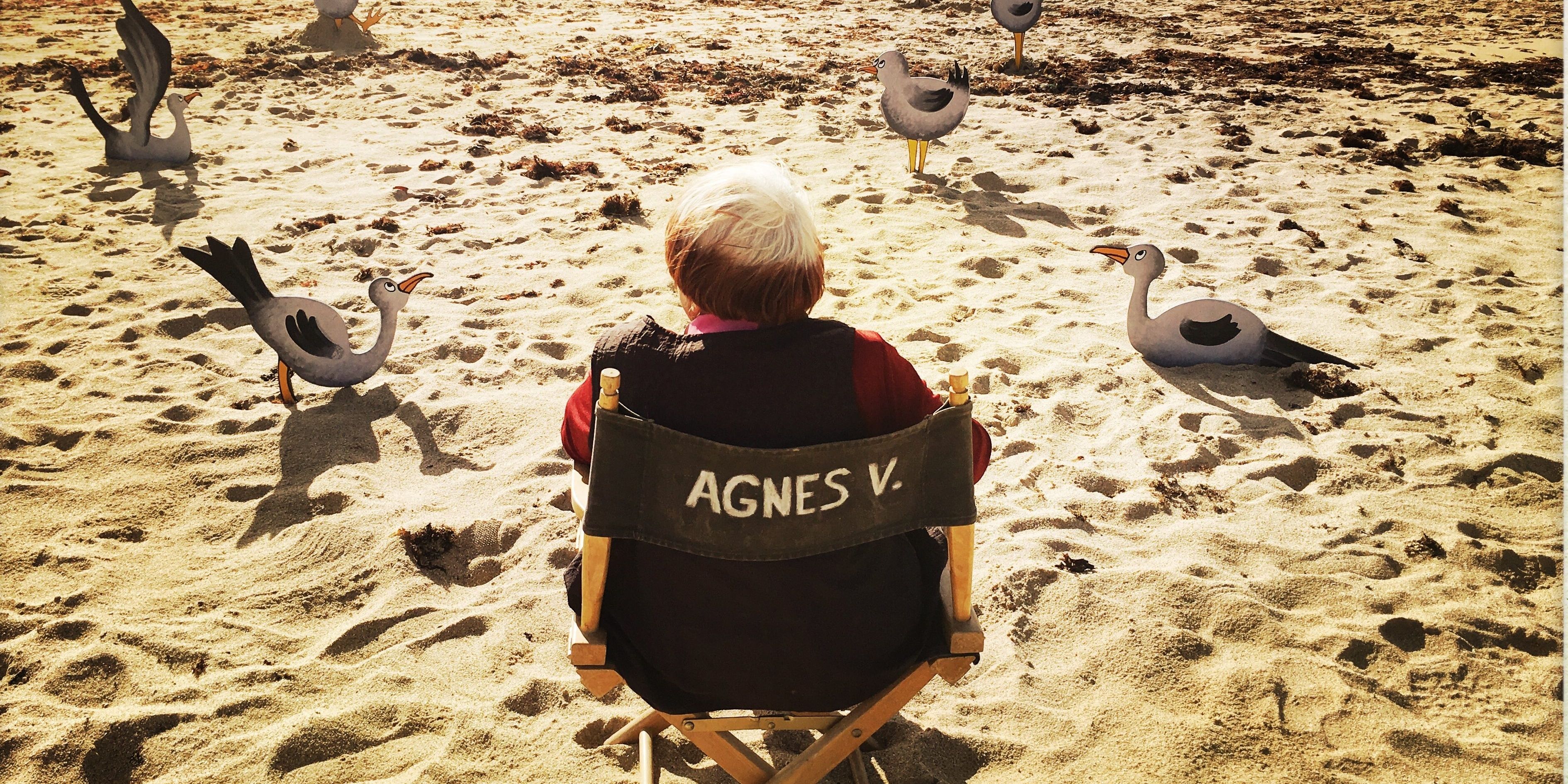 Agnes Varda sitting in her directorial chair in Varda by Agnes