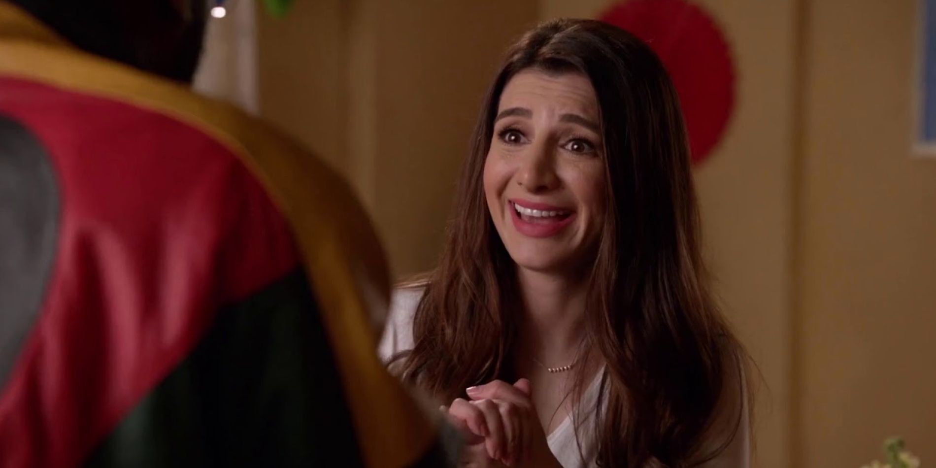 Aly smiling excitedly in New Girl