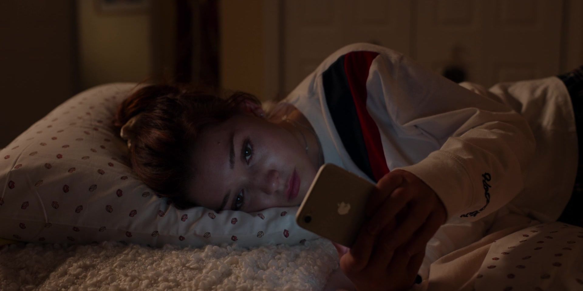 Abby from Ginny &amp; Georgia Lays in bed at night scrolling through her phone