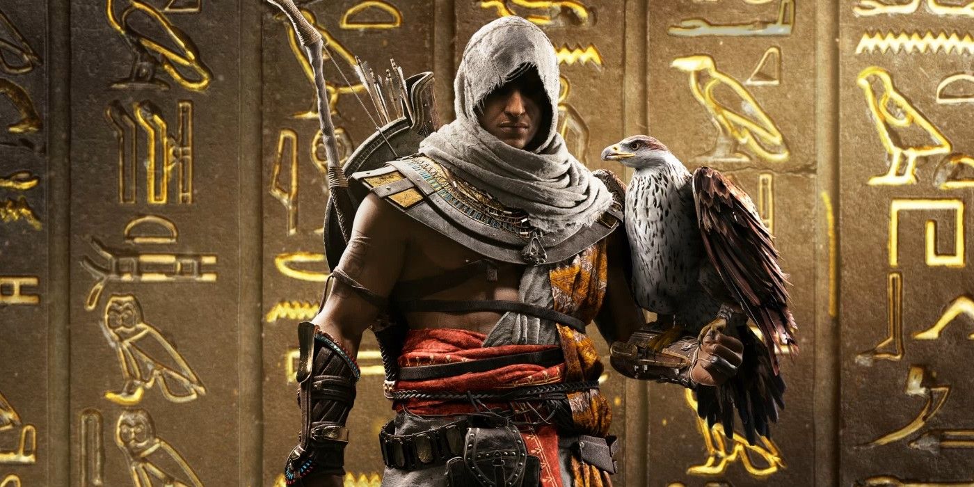 Bayek and his Eagle in front of a wall with hieroglyphics in Assassin's Creed