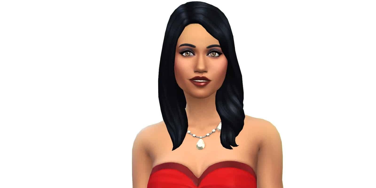 Bella Goth stands in front of a white background