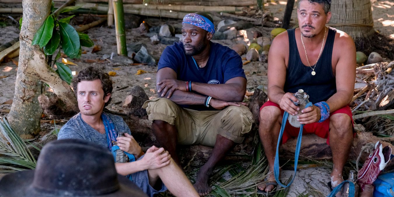 Survivor's Adam, Jeremy, and Rob sitting at camp