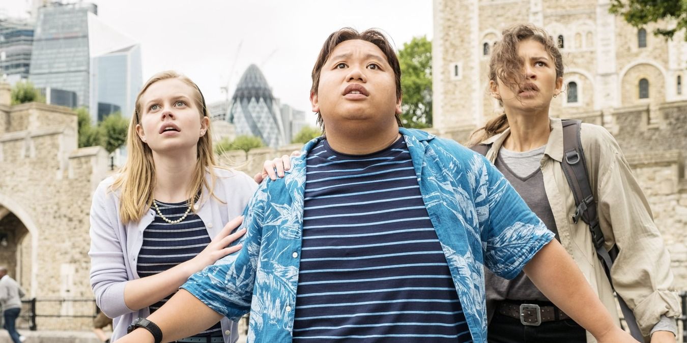 Betty, Ned, and MJ standing outside the building as it collapses