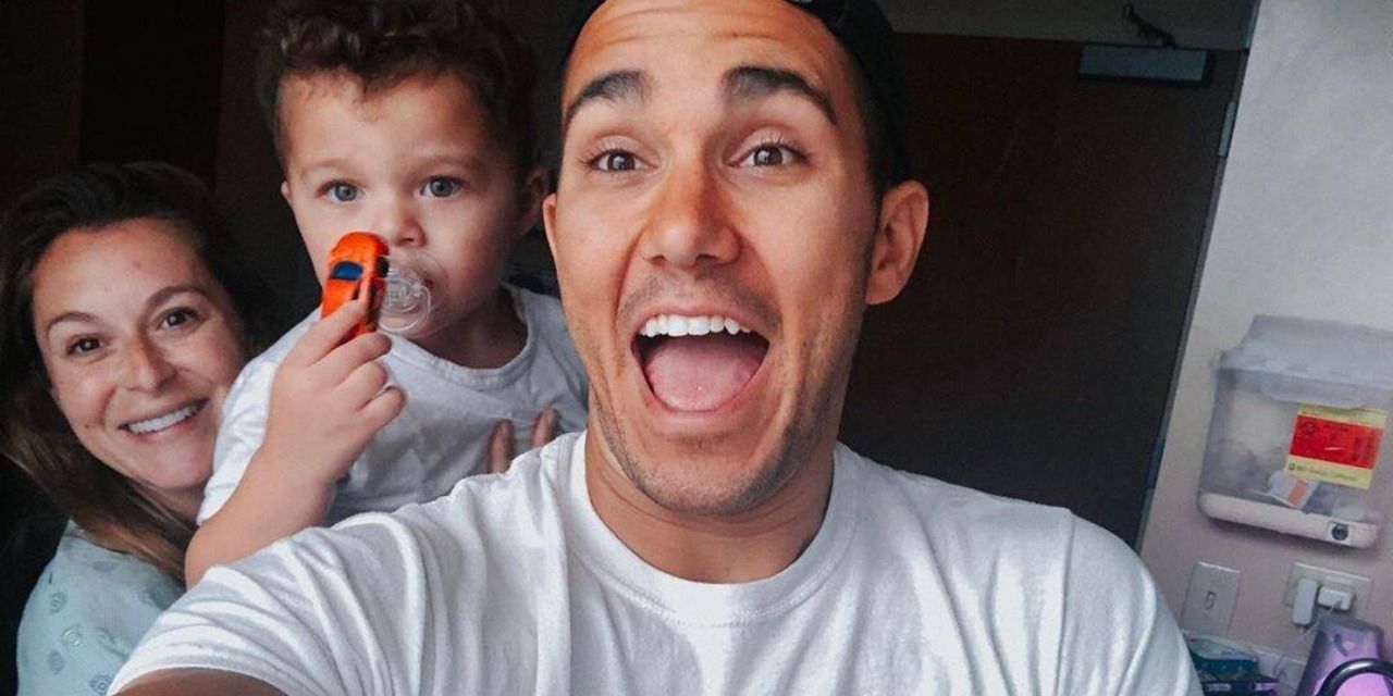 Carlos PenaVega laughs with his famliy in the background