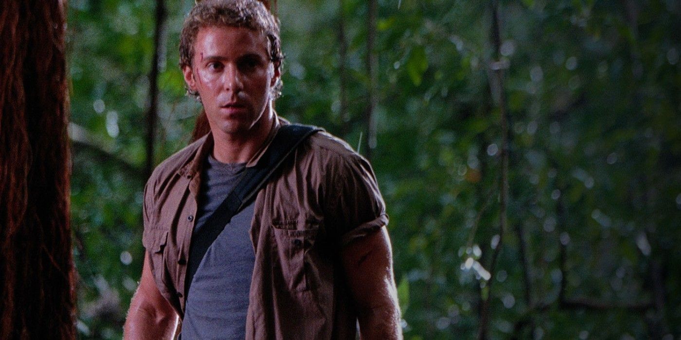 Billy Brennan stands in the jungle in Jurassic Park III.