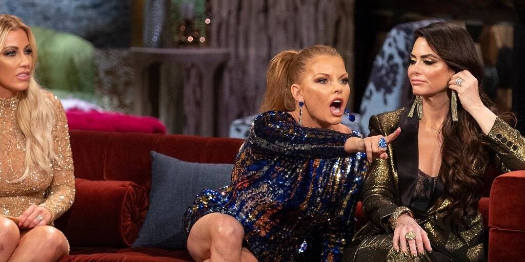 Brandi argues from a couch at the Real Housewives of Dallas reunion