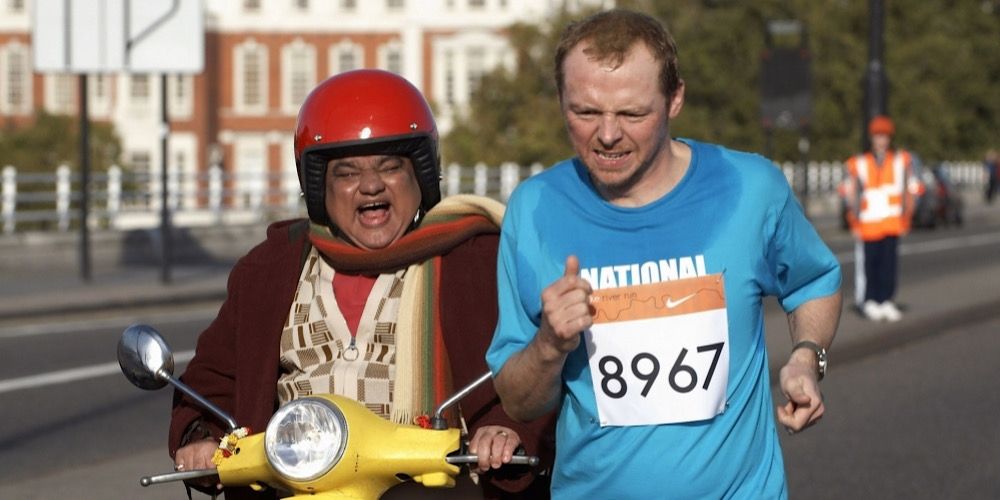Dennis runs alongside a scooter in Run Fatboy Run