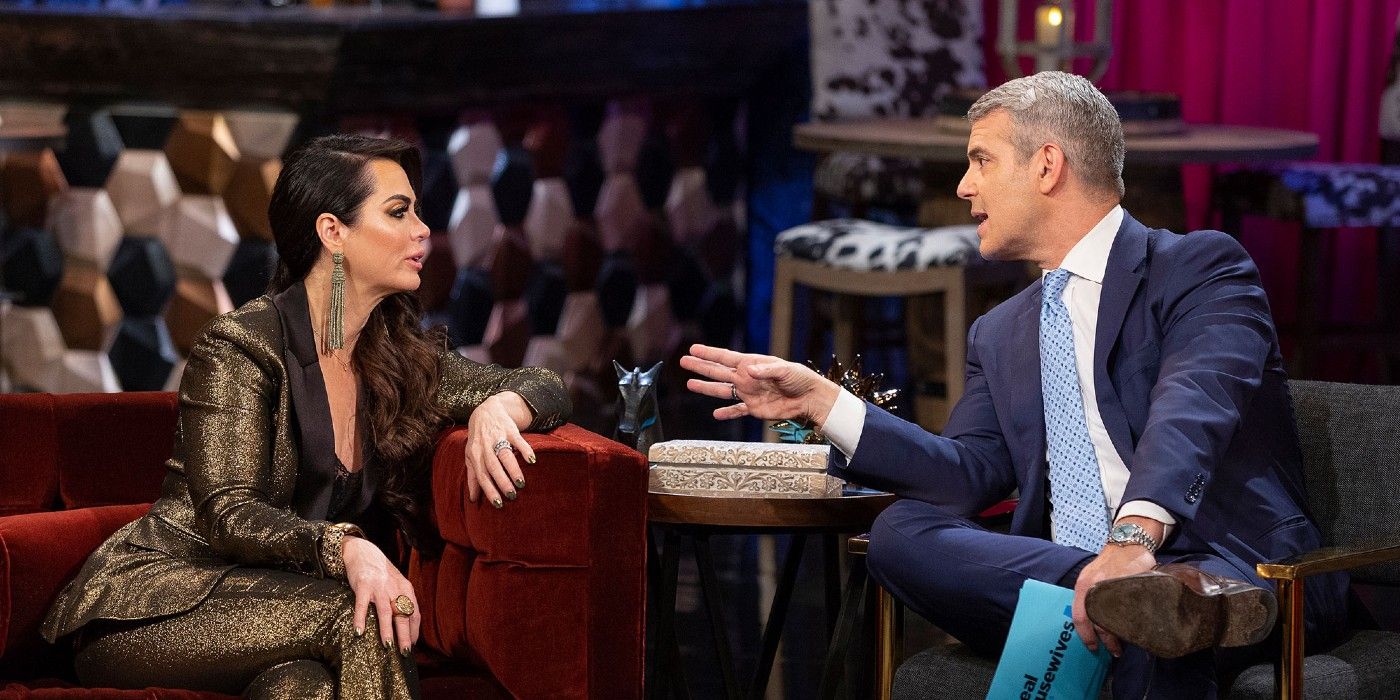 DAndra Simmons talks to Andy Cohen on a couch