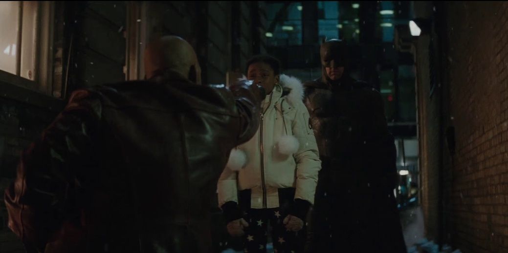 Deadshot points gun at Batman but his daughter intervenes in Suicide Squad