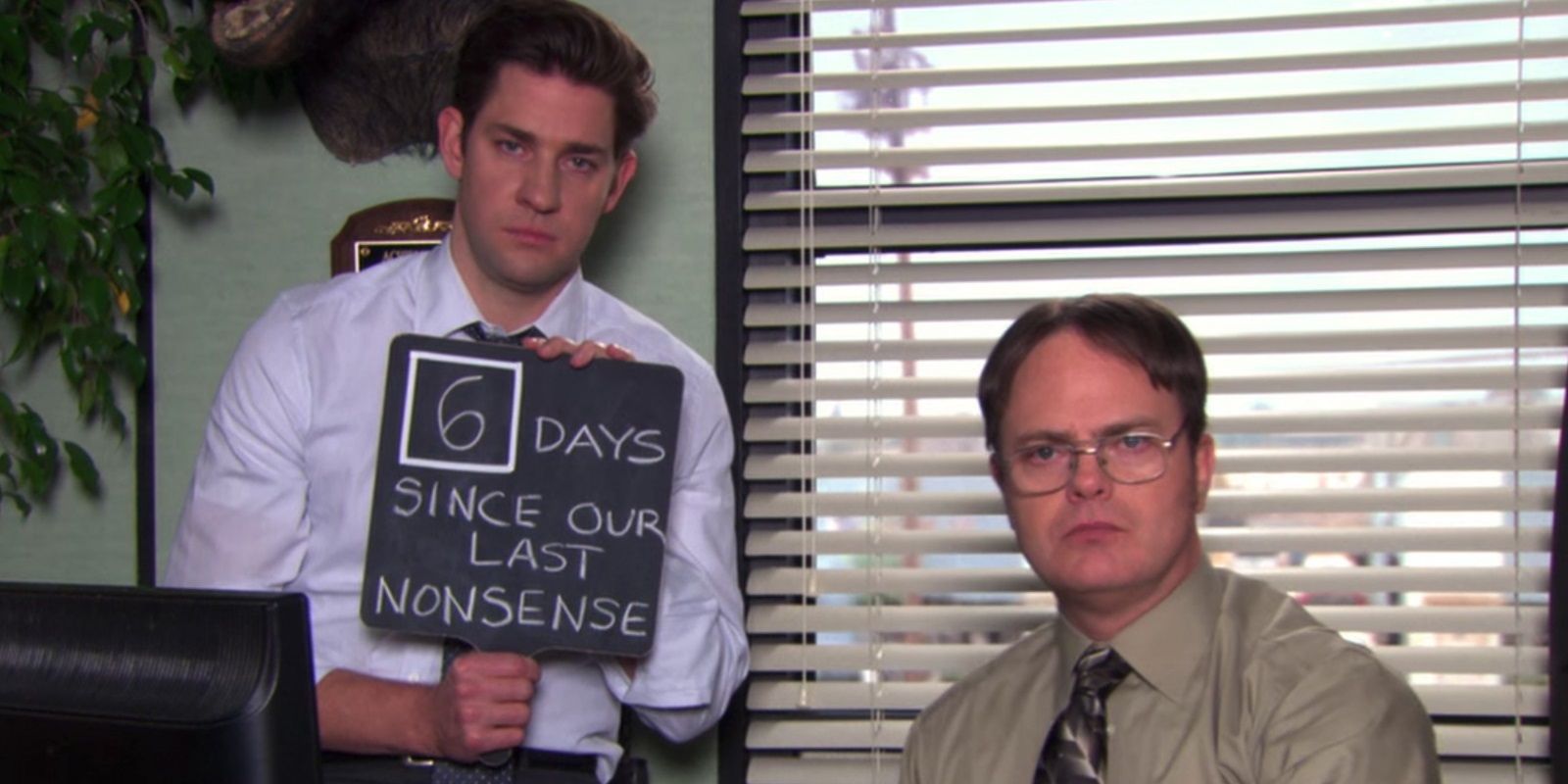 Jim holds up a chalk board that shows how many days the office has been “no-nonsense” for in The Office
