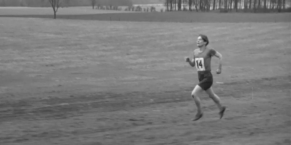 Colin runs through a field in The Loneliness of the Long Distance Runner